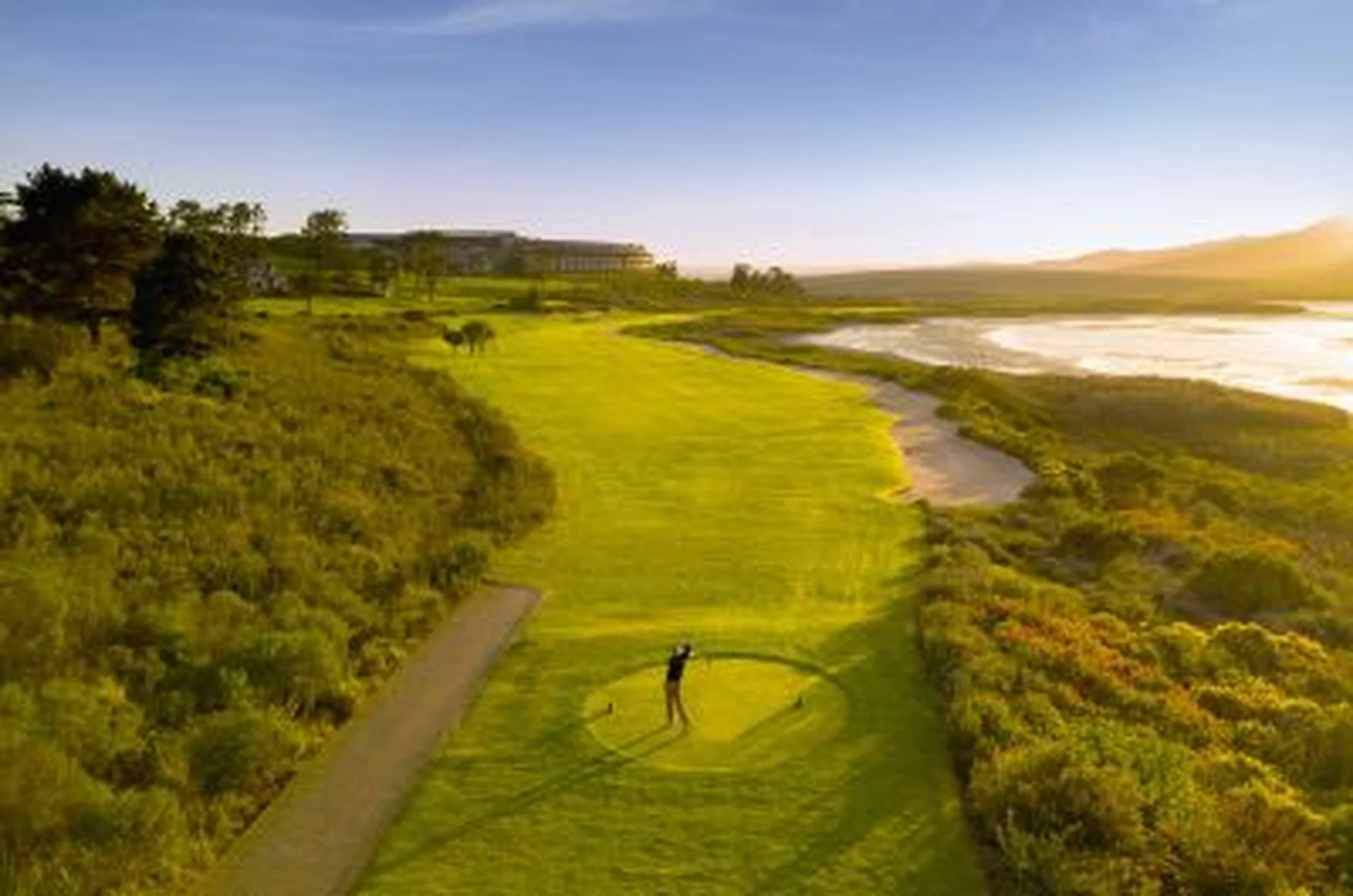 Coastal golf at sunset